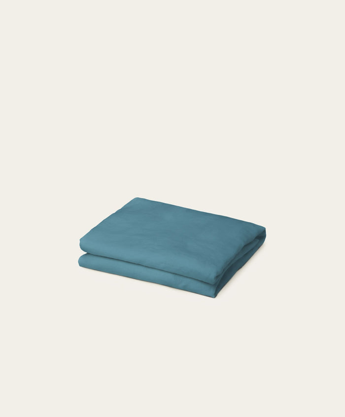 Linen Fitted Sheet by Fable Home, shown in Storm Blue. – #stormblue/full #stormblue/queen #stormblue/king