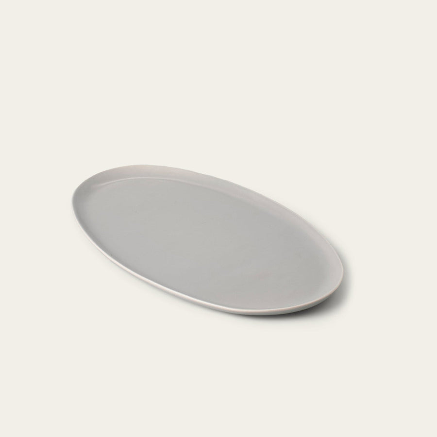 Oval serving platter dinnerware by Fable Home, shown in a dovegray finish. – #dovegray