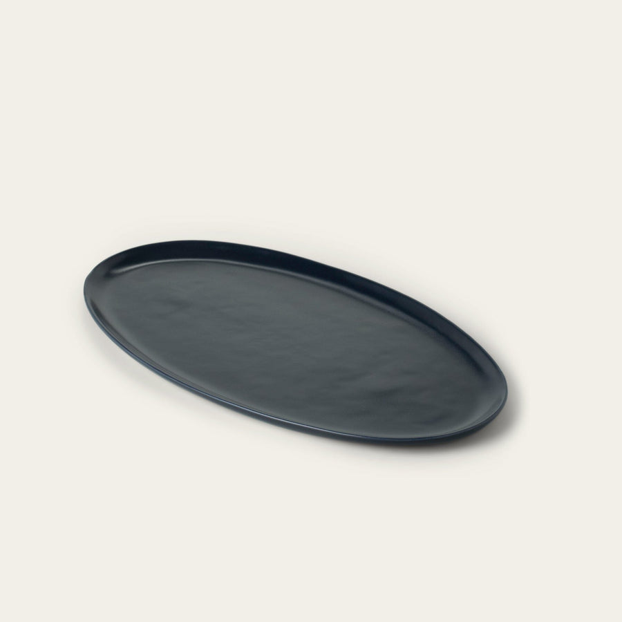 Oval serving platter dinnerware by Fable Home, shown in a midnightblue finish. – #midnightblue