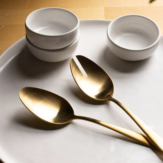 Serving spoons flatware by Fable Home, shown in a mattegold finish. – #mattegold
