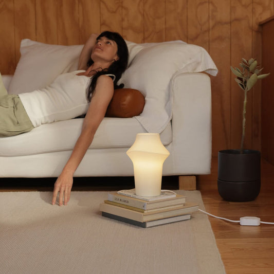 Curve table light lighting by Fable Home, shown in a translucent finish. – #translucent
