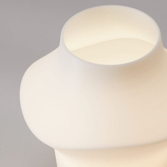 Curve table light lighting by Fable Home, shown in a translucent finish. – #translucent