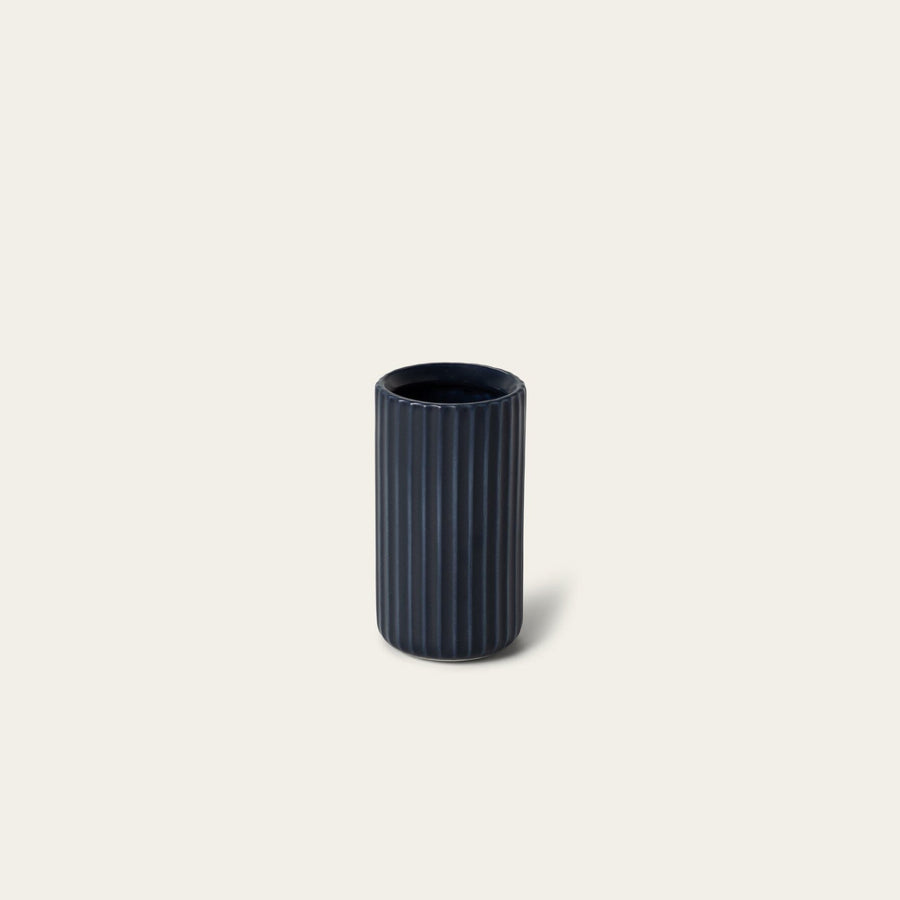 Short bud vase decor by Fable Home, shown in a midnightblue finish. – #midnightblue