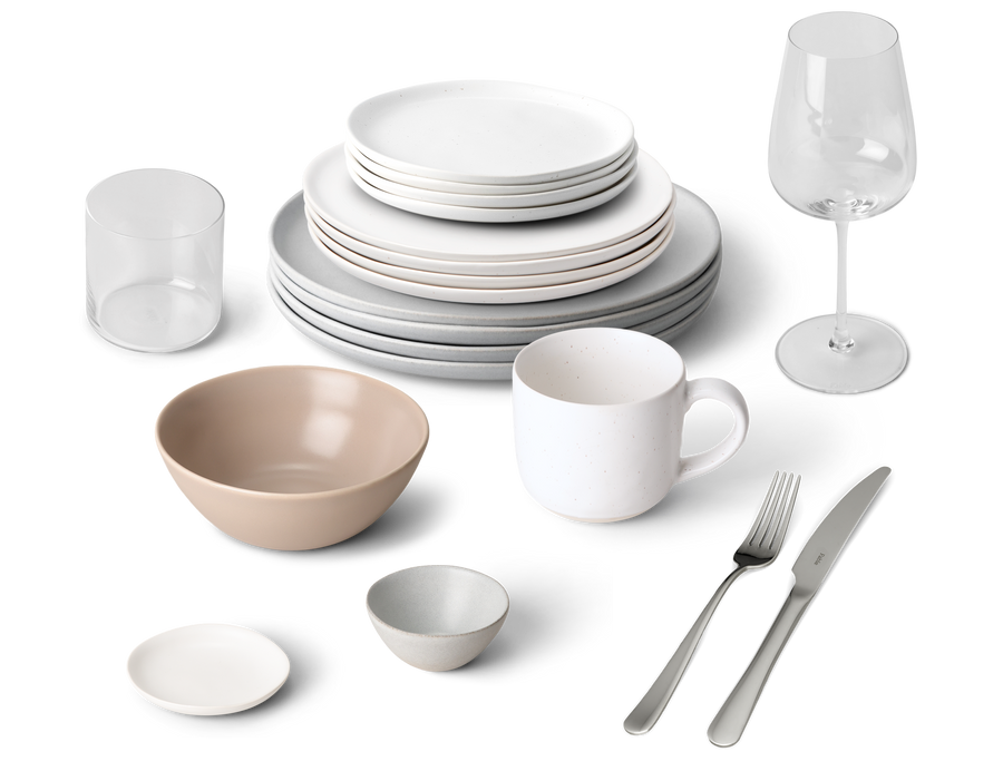 Fable build-your-own-bundle homeware spread with white plates, beige bowls, clear glasses, wine glass and flatware