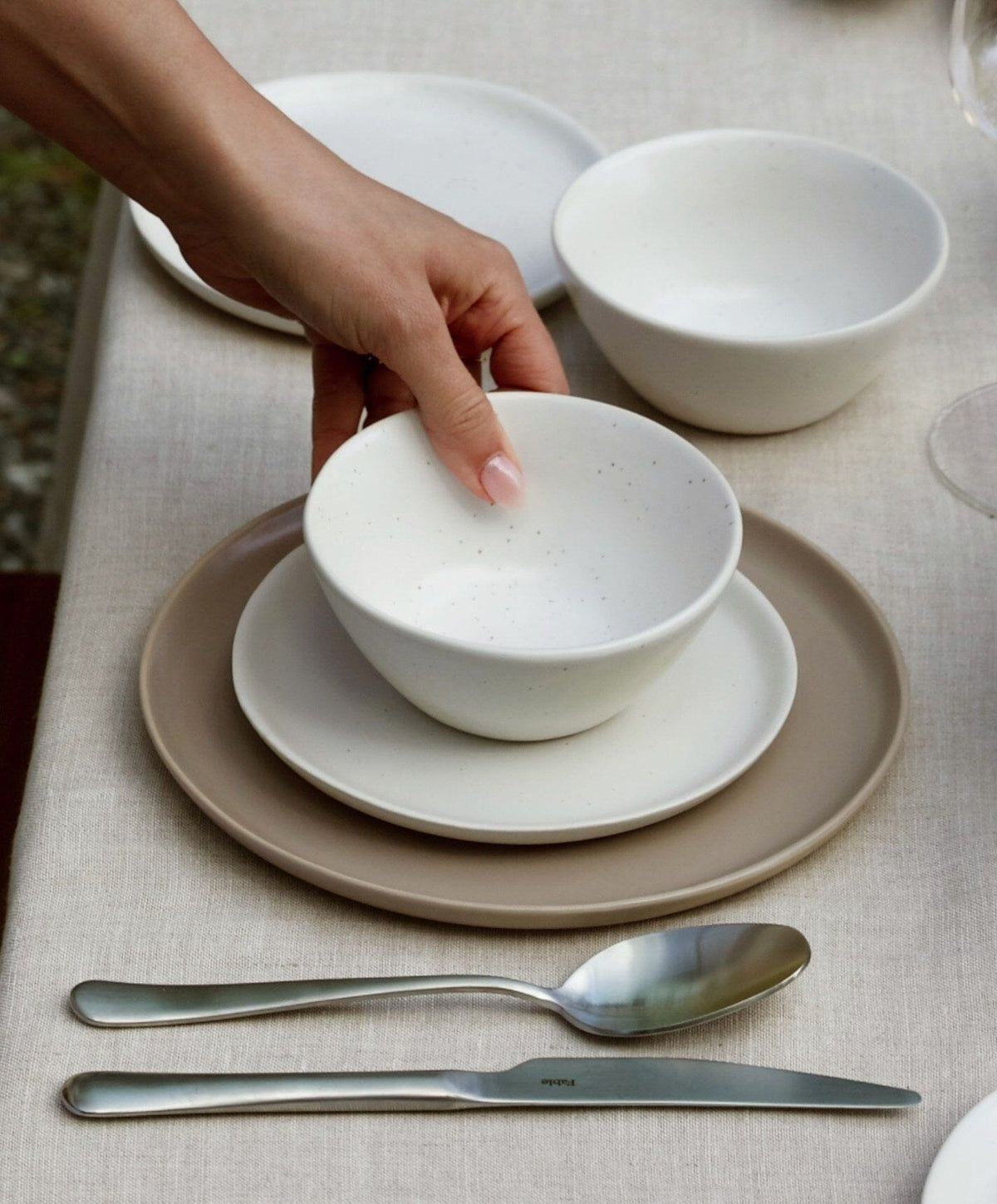 Complete Dinnerware Set by Fable Home, shown in Speckled White.