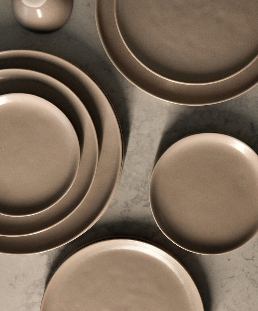 Complete Dinnerware Set by Fable Home, shown in Desert Taupe.