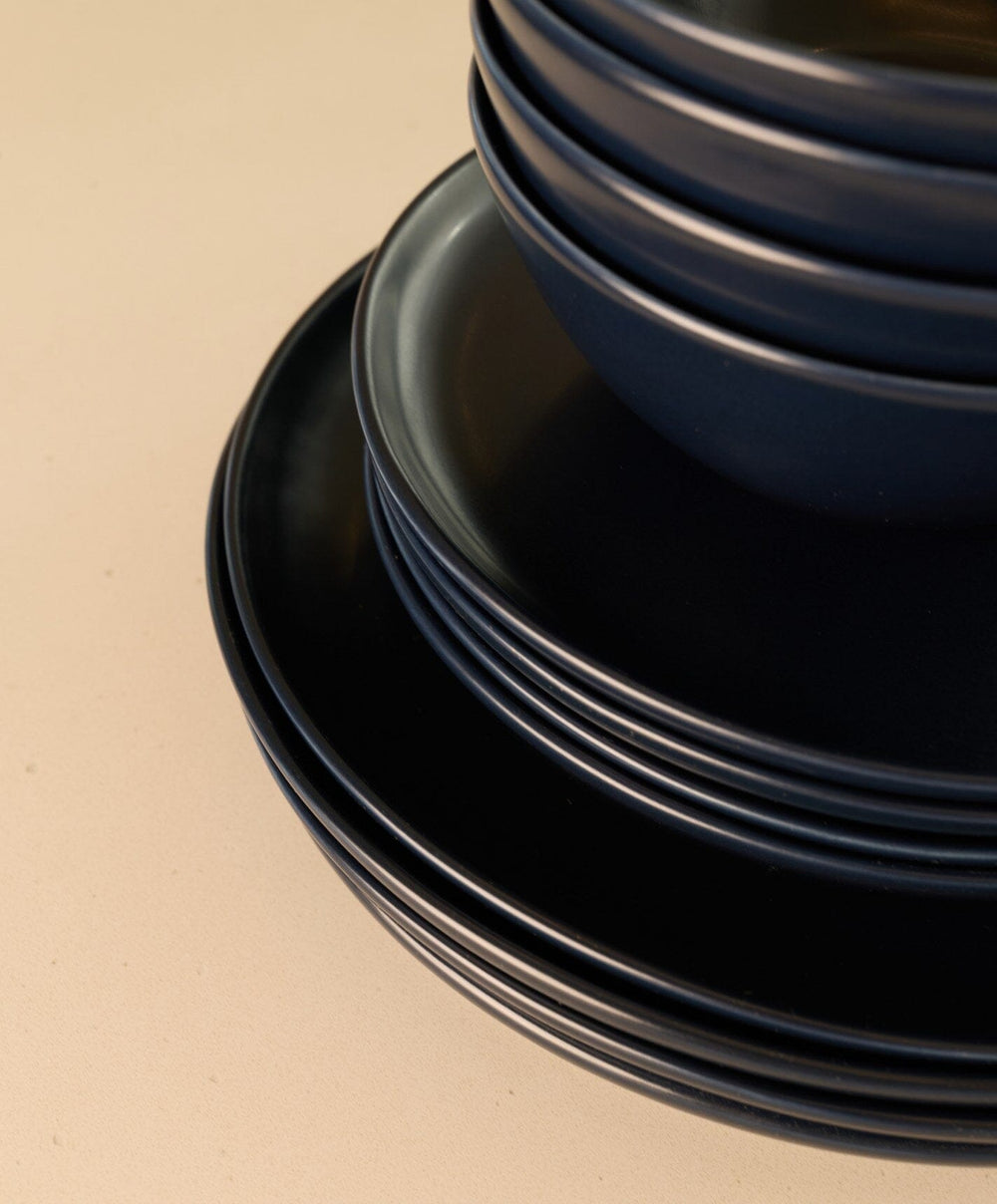 Complete Dinnerware Set by Fable Home, shown in Midnight Blue.