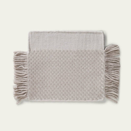 Fringe Wool Rug on a light beige background. #foggray