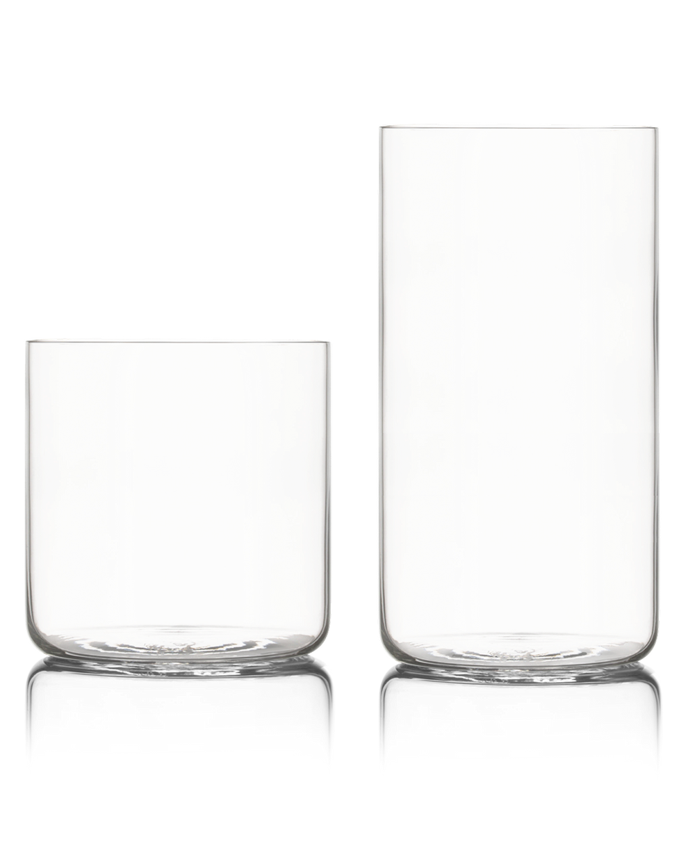 Fable clear glass tumbler and tall highball glass side by side on a white background