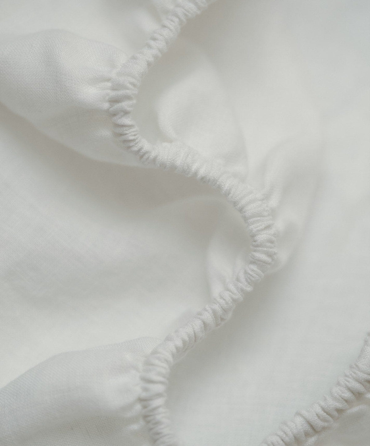 Linen Fitted Sheet by Fable Home, shown in Shell White.