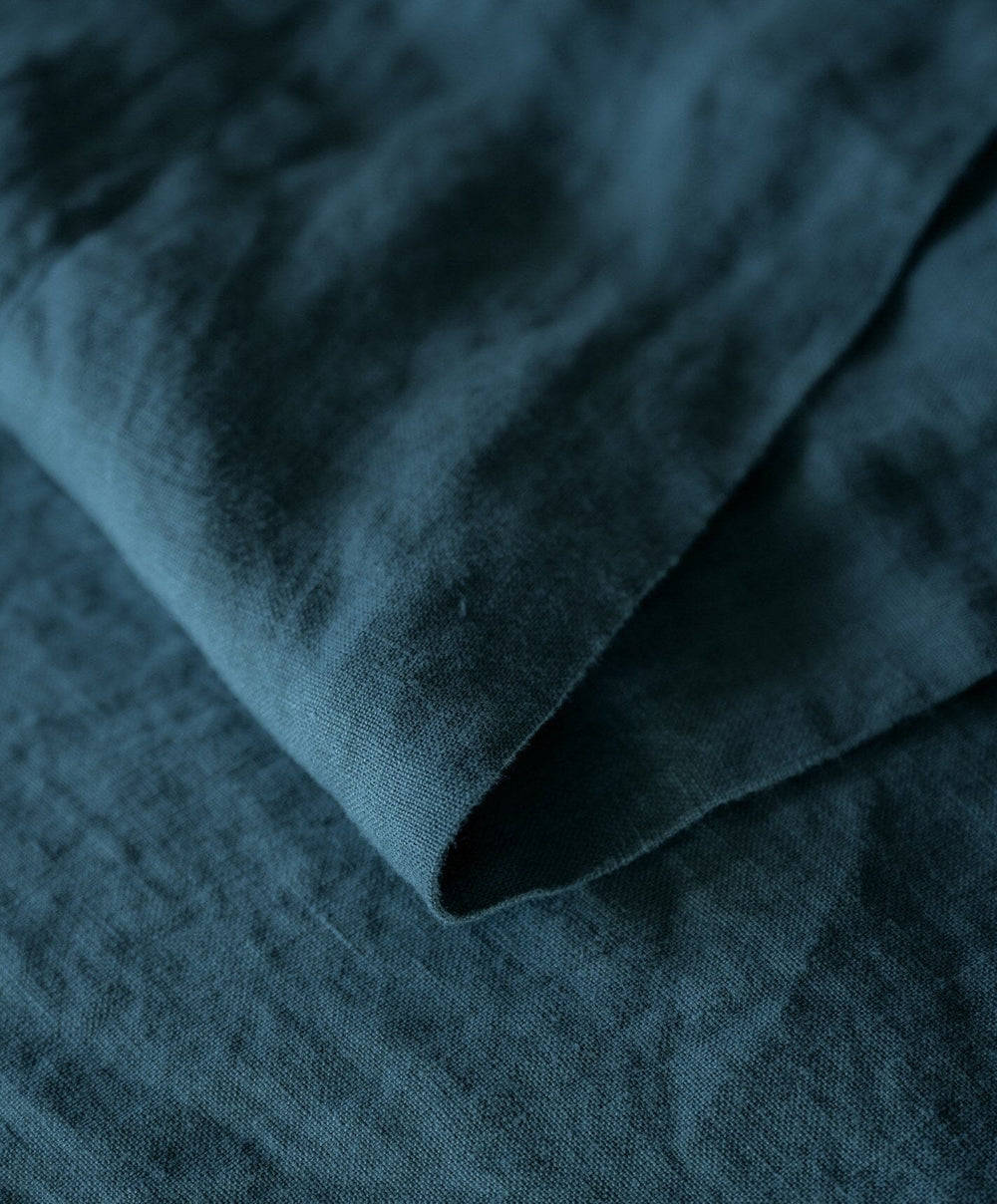 Linen Flat Sheet by Fable Home, shown in Storm Blue.