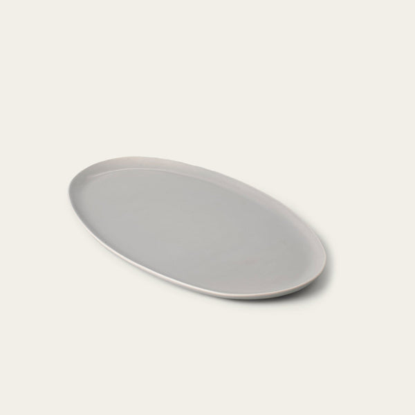 Oval serving platter dinnerware by Fable Home, shown in a dovegray finish. – #dovegray