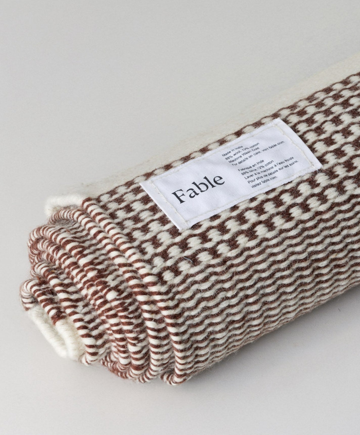 Linear Wool Rug by Fable Home, shown in Burnt Sienna.