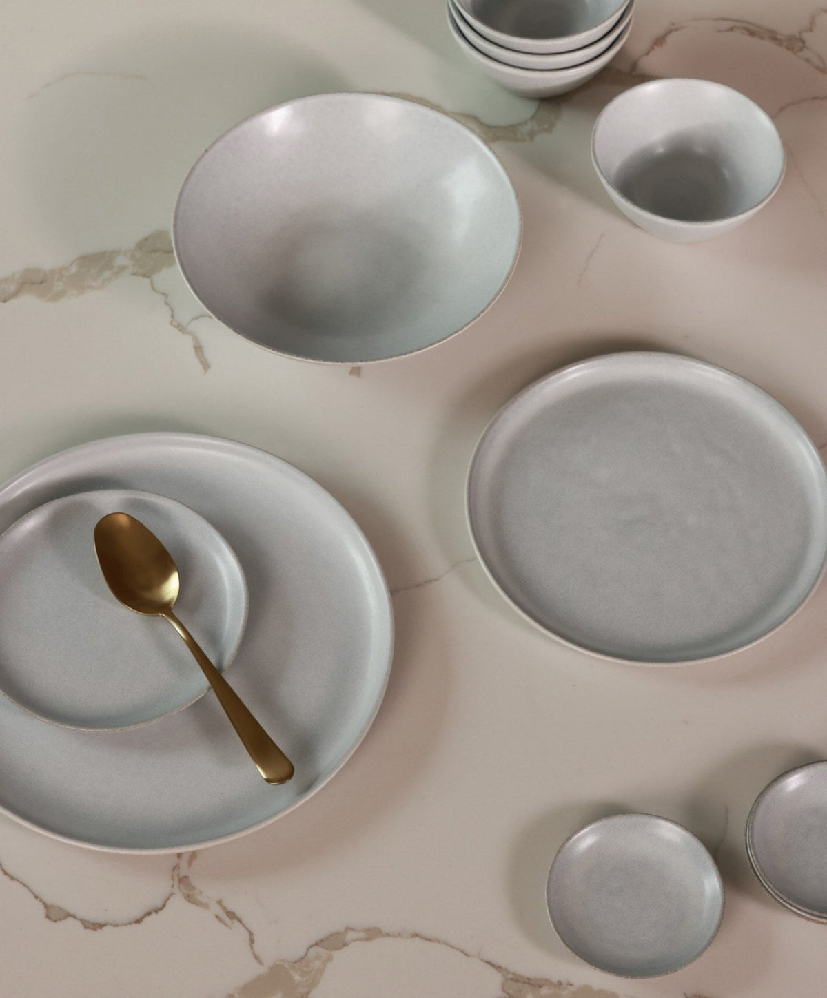 Dinner Plates by Fable Home, shown in Stone Blue.