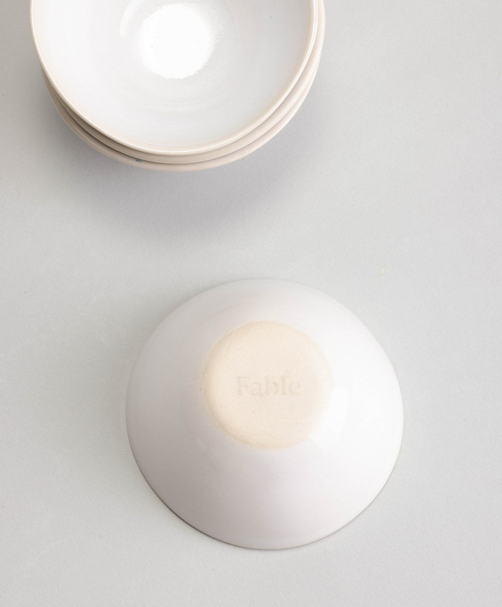 Little Bowls by Fable Home, shown in Speckled White and Dove Gray and Midnight Blue.