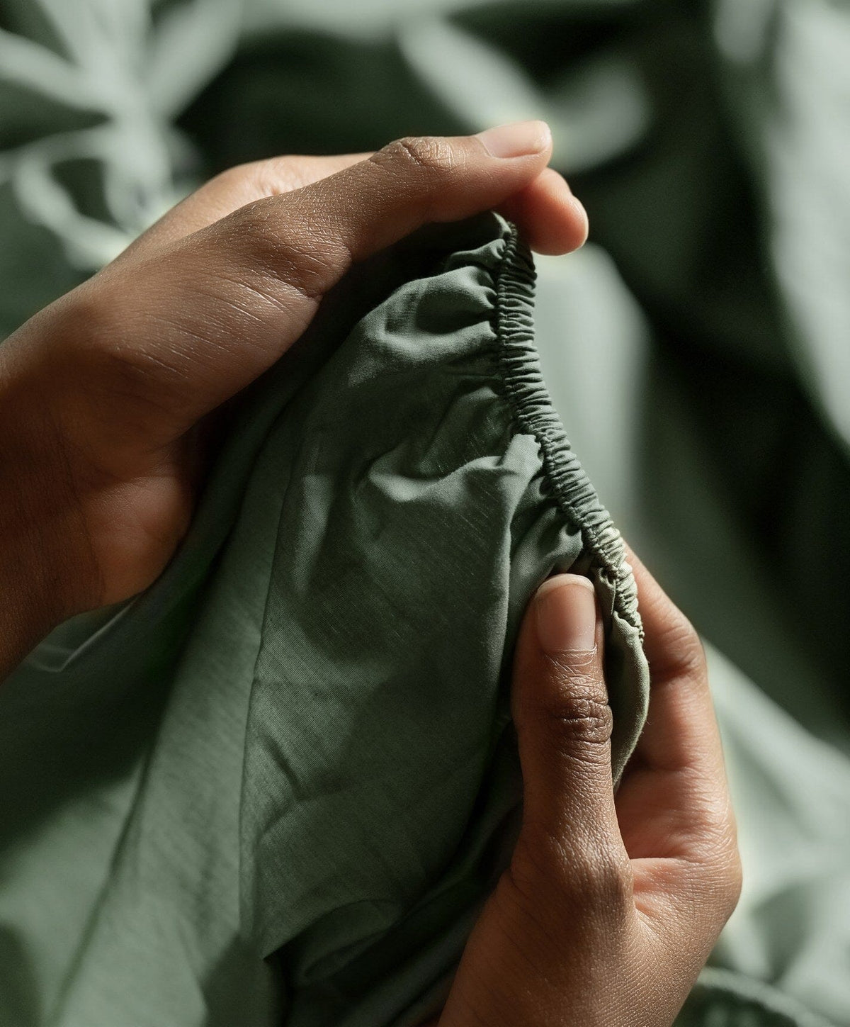 Percale Fitted Sheet by Fable Home, shown in Juniper Green.