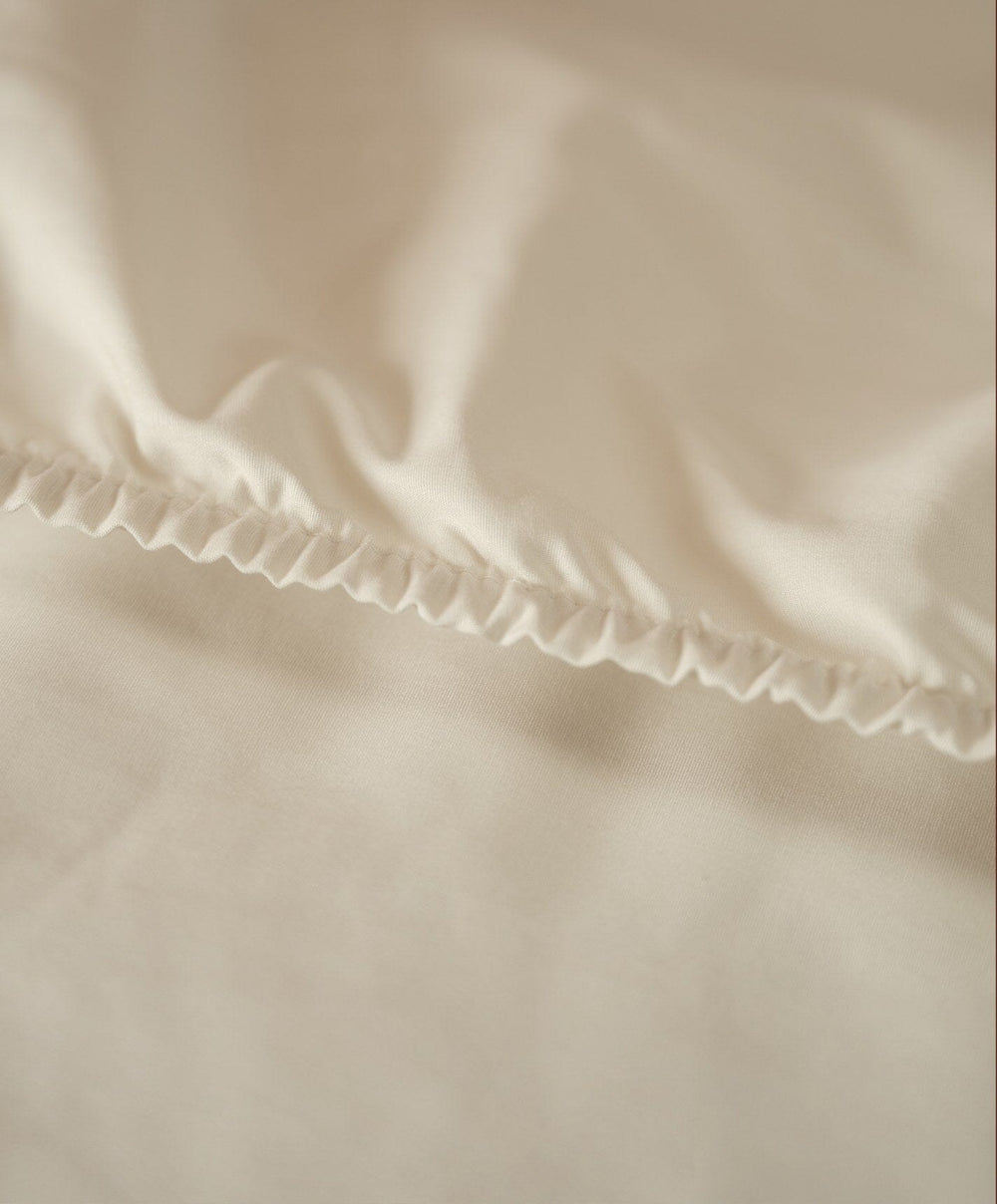 Percale Fitted Sheet by Fable Home, shown in Birch Sand.