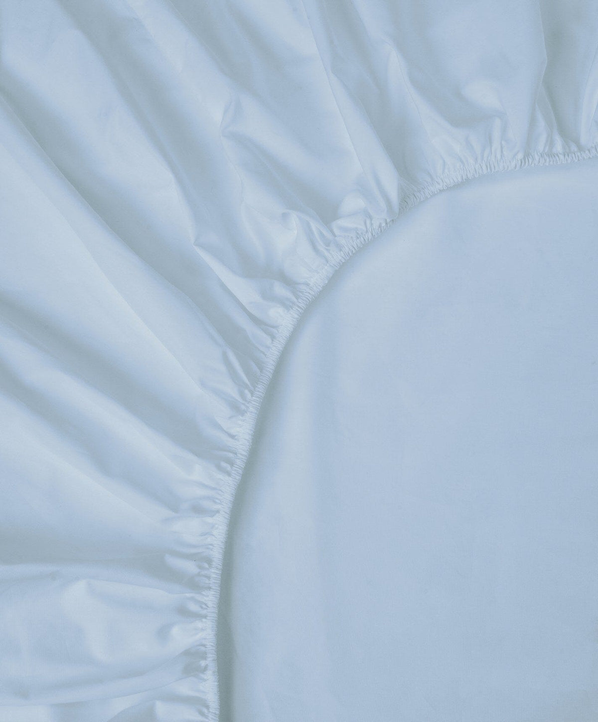 Percale Fitted Sheet by Fable Home, shown in Meadow Blue.
