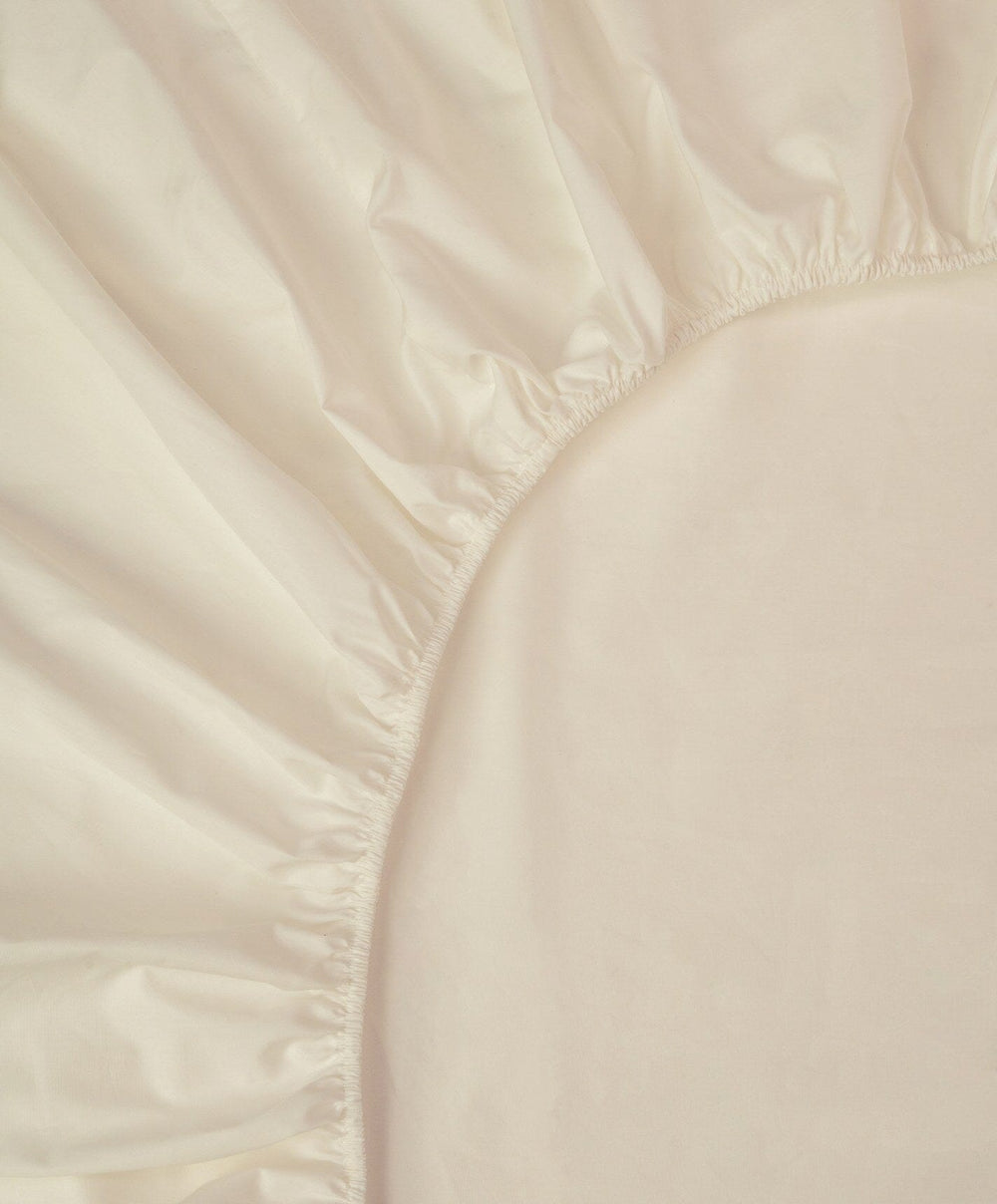 Percale Fitted Sheet by Fable Home, shown in Birch Sand.