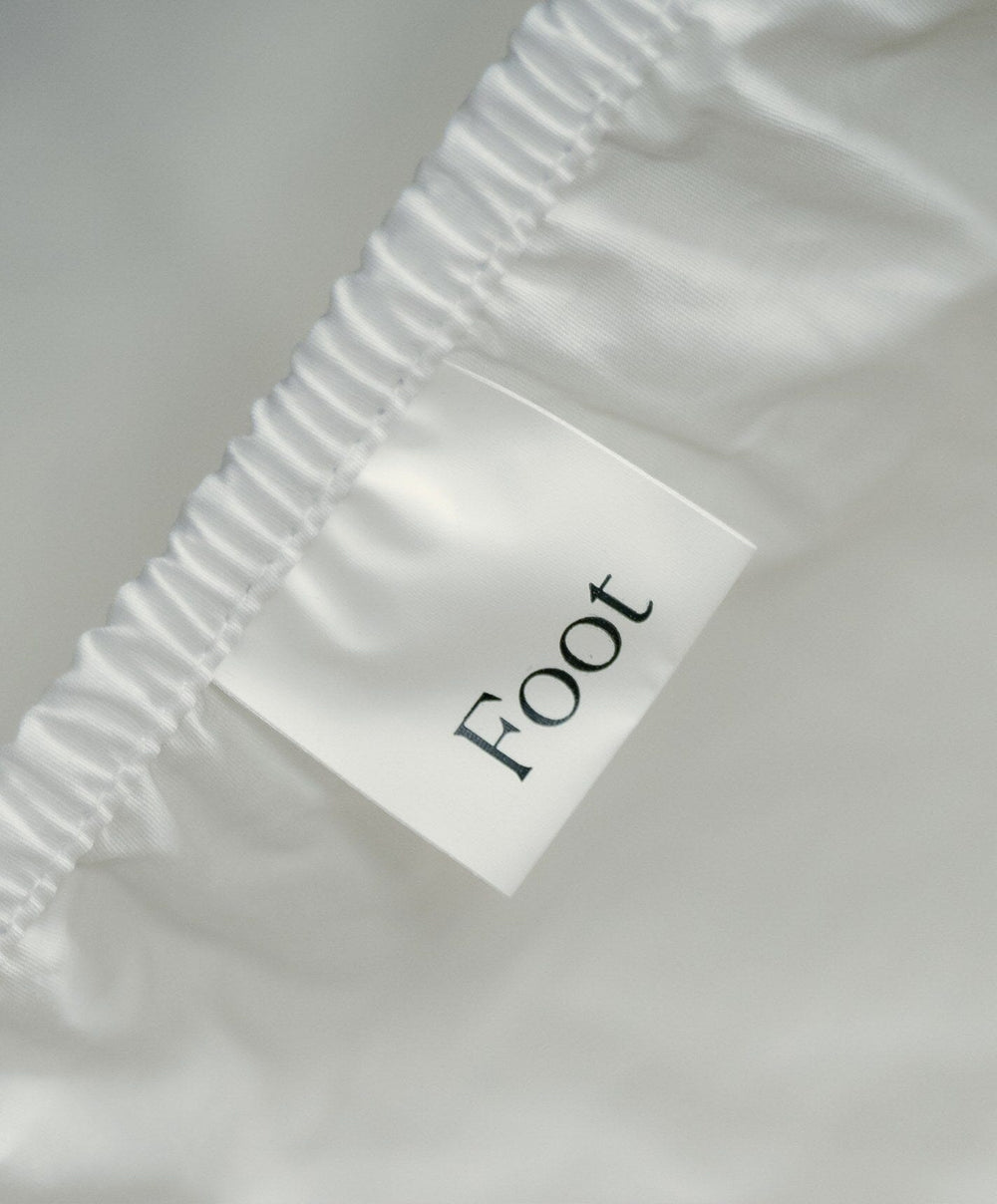 Percale Fitted Sheet by Fable Home, shown in Shell White.