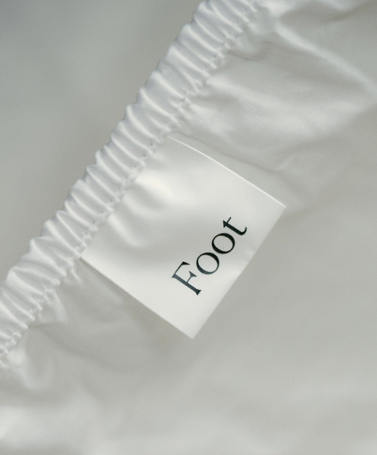 Percale Fitted Sheet by Fable Home, shown in Shell White.