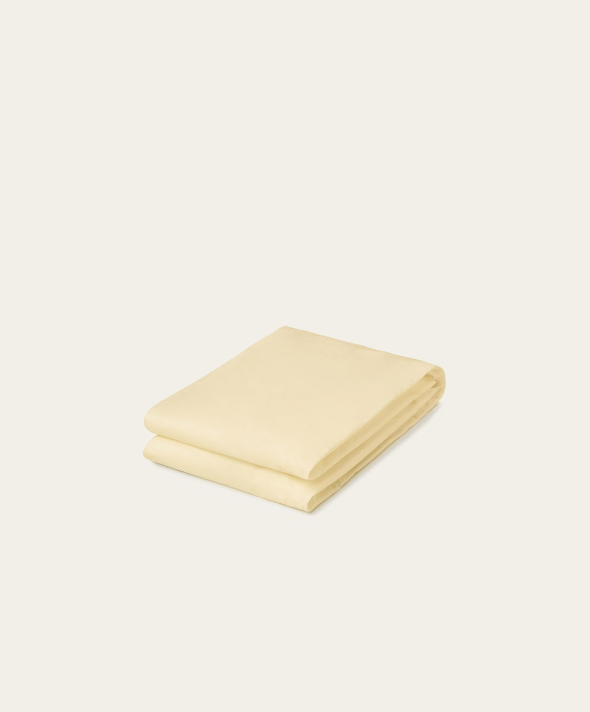 Percale Fitted Sheet by Fable Home, shown in Buttercup Yellow.