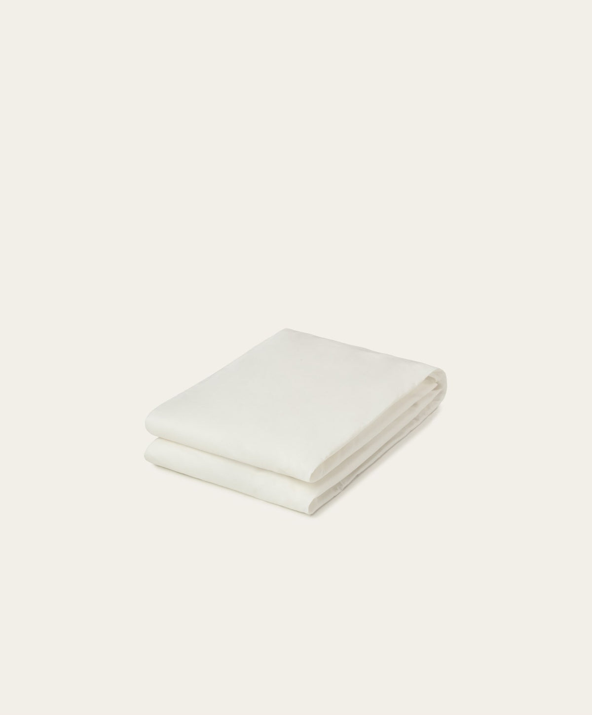 Percale Fitted Sheet by Fable Home, shown in Shell White.