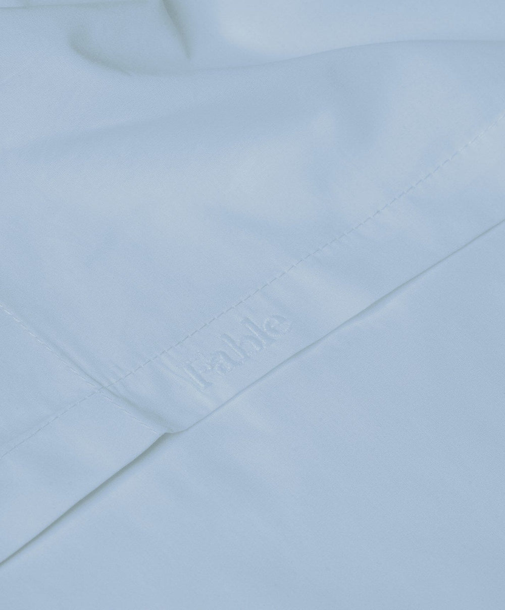 Percale Flat Sheet by Fable Home, shown in Meadow Blue.