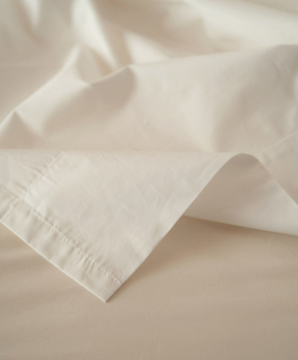 Percale Flat Sheet by Fable Home, shown in Birch Sand.