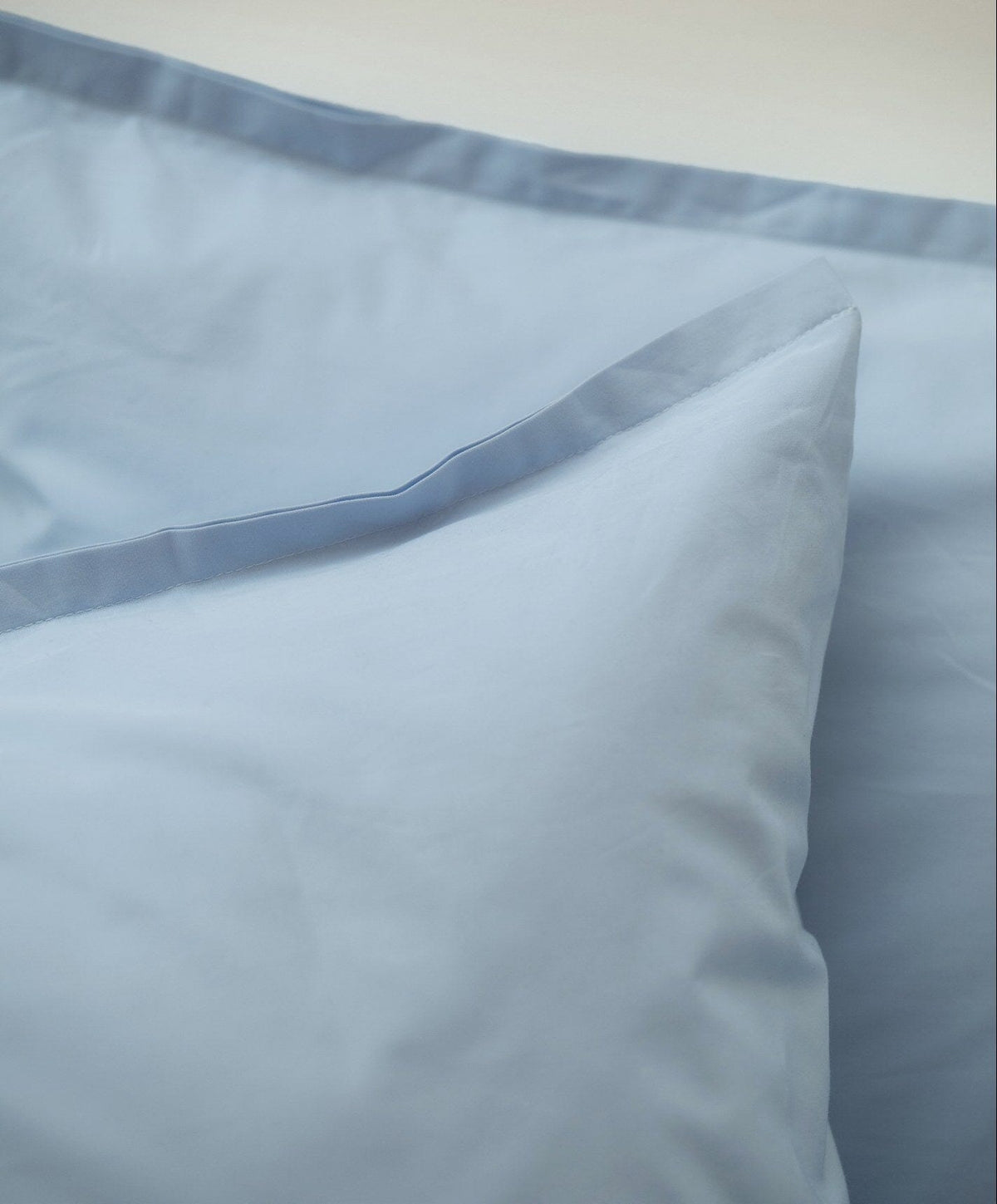 Percale Pillowcase Pair by Fable Home, shown in Meadow Blue.