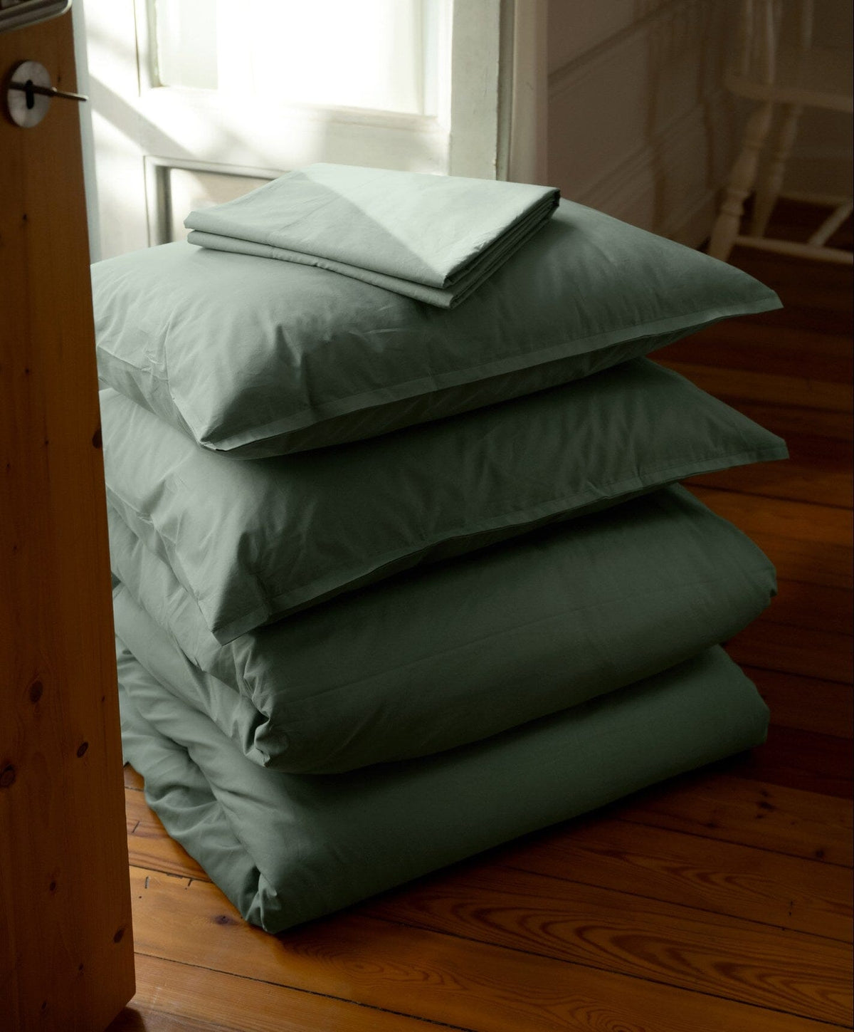 Percale Pillowcase Pair by Fable Home, shown in Juniper Green.