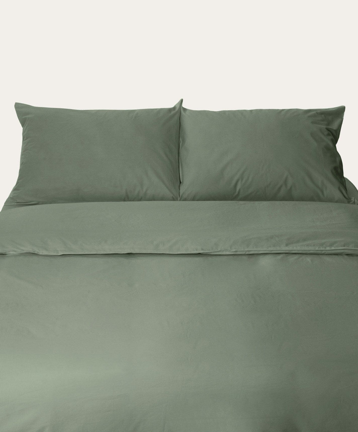 Percale Pillowcase Pair by Fable Home, shown in Juniper Green.
