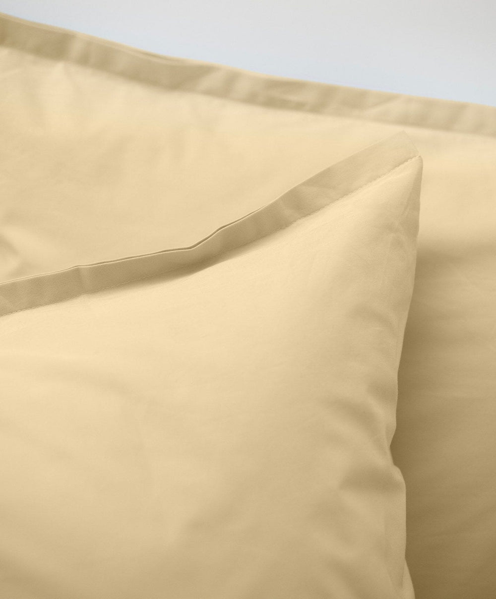 Percale Pillowcase Pair by Fable Home, shown in Buttercup Yellow.