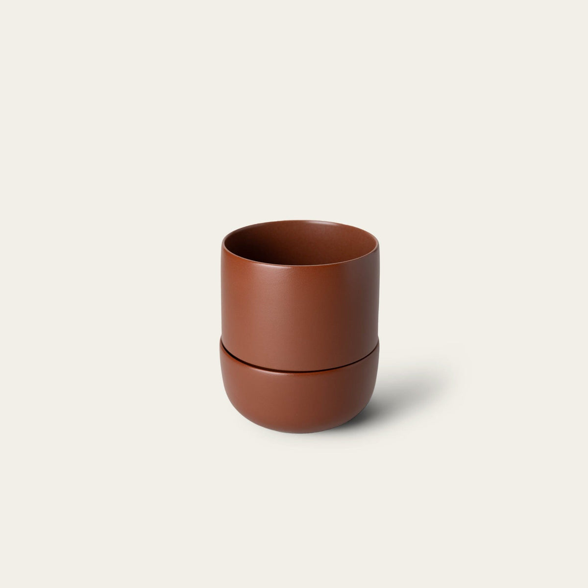 Planter planters by Fable Home, shown in a large/burntsienna finish.