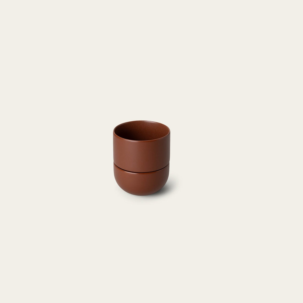 Planter planters by Fable Home, shown in a small/burntsienna finish.