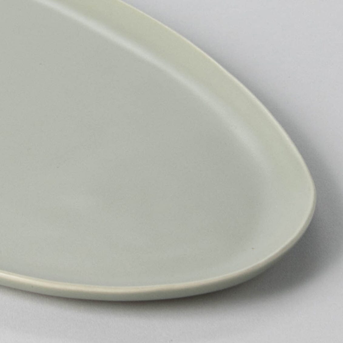 Serving ceramics set bundles by Fable Home, shown in a beachgrassgreen finish.