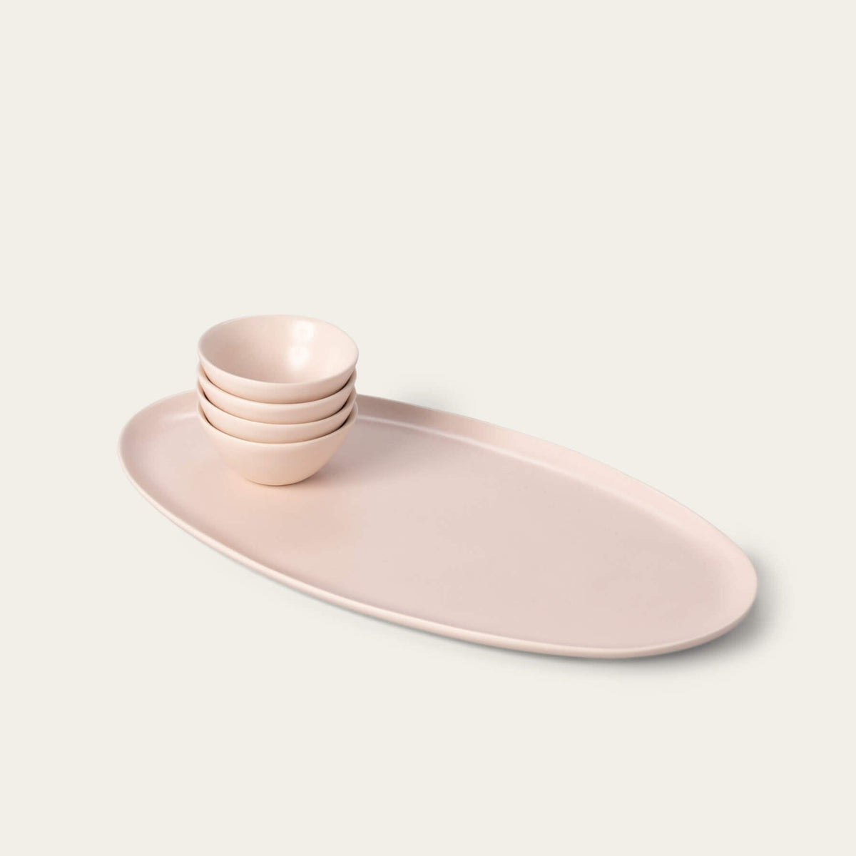 Serving platter set bundles by Fable Home, shown in a blushpink finish.